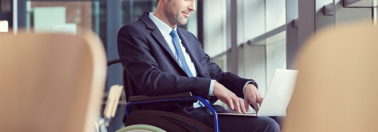 Disabled businessman working in an office