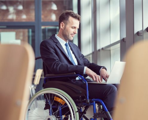 Disabled businessman working in an office