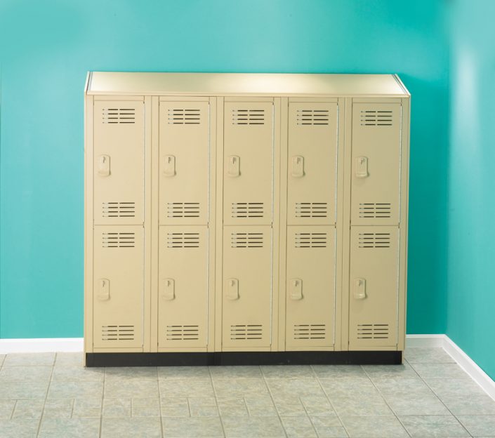 Beige Tufftec Lockers Next To Aqua Wall